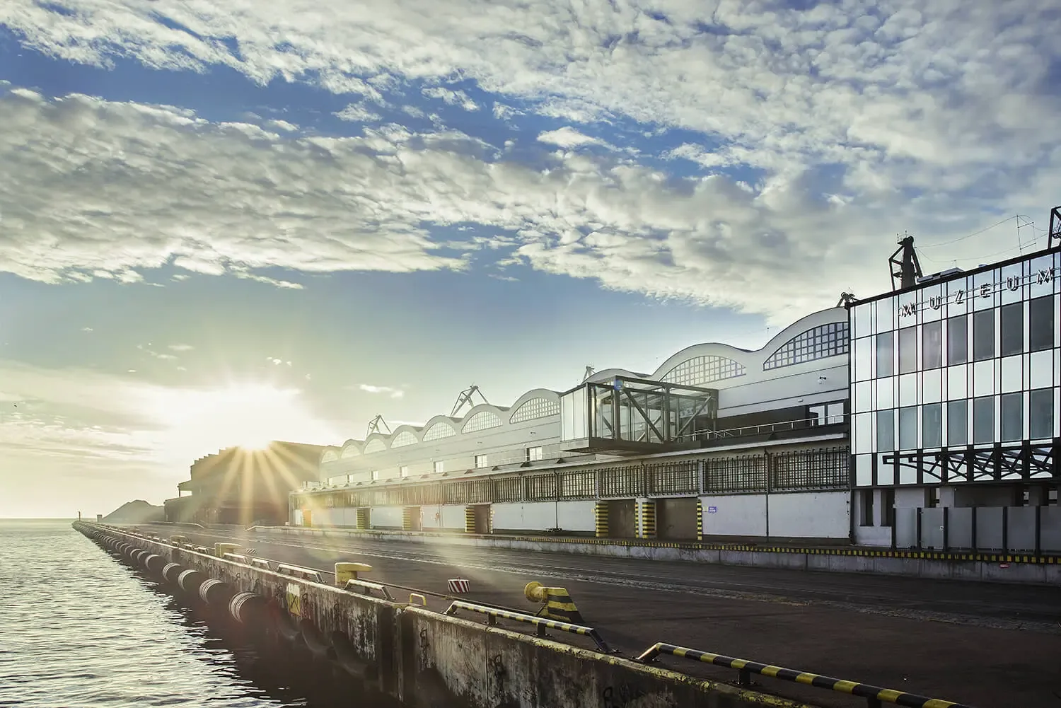 Historic Marine Station on Gdynia’s waterfront at sunrise, home of the Emigration Museum