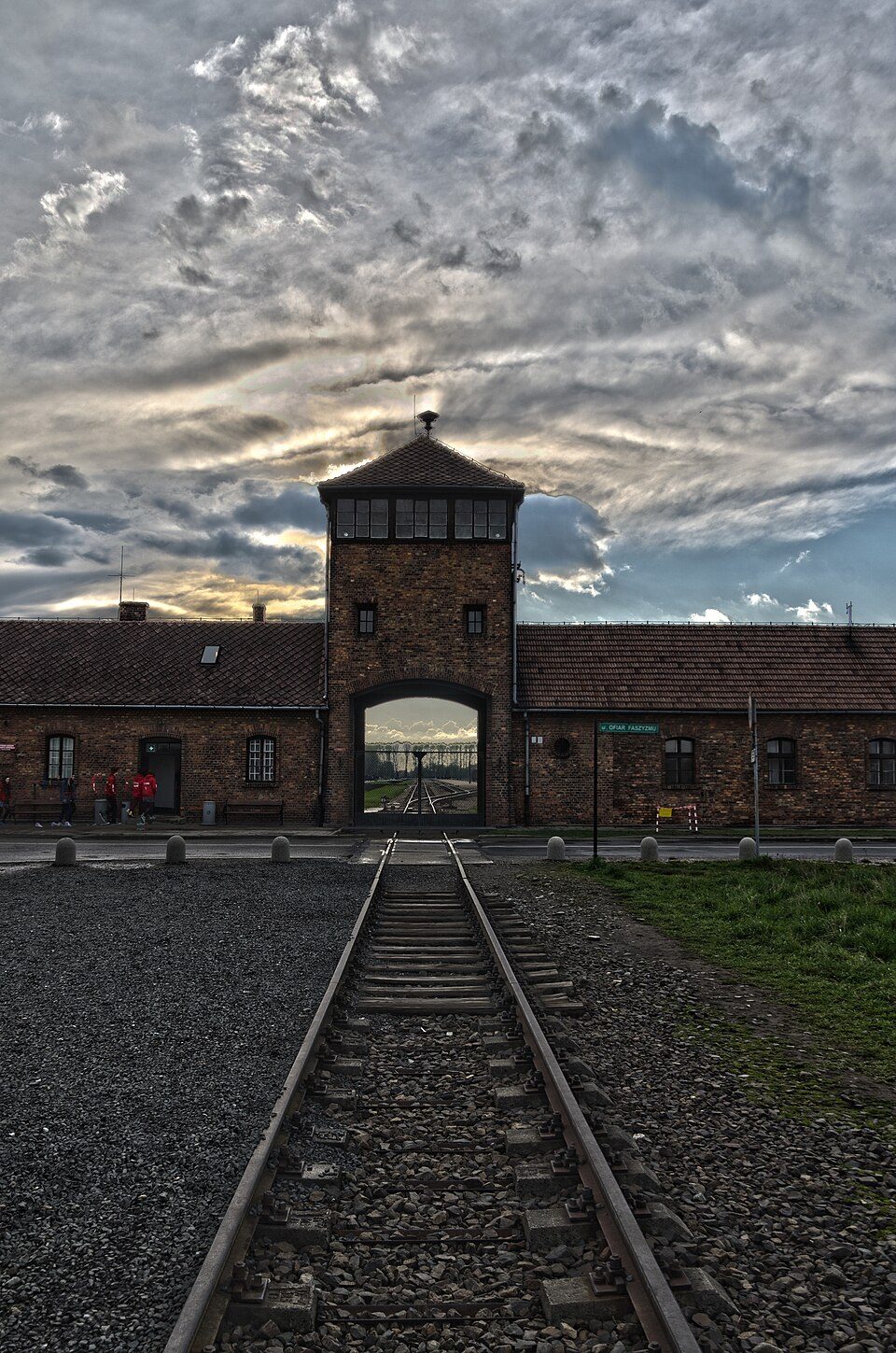 Railway tracks leading through the entrance building at the Auschwitz II-Birkenau Memorial