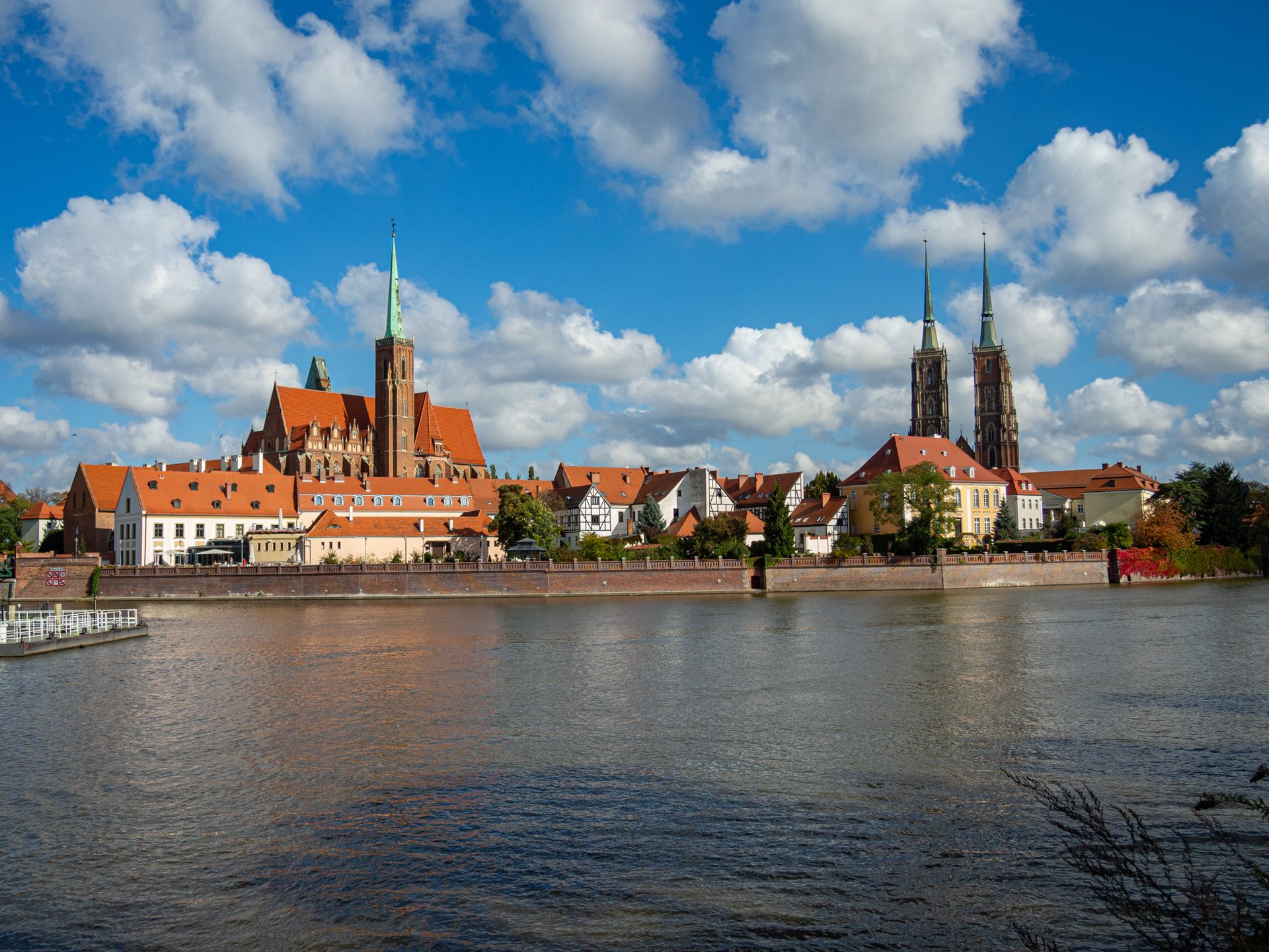 Cathedral Island in Wrocław at dusk, with church spires above the Oder