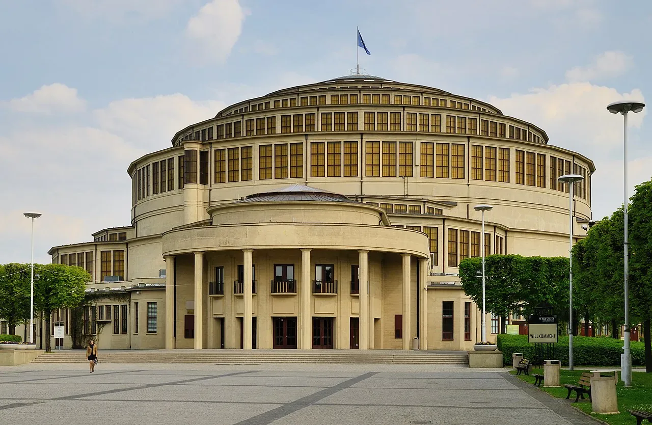 The monumental concrete exterior of Centennial Hall in Wrocław