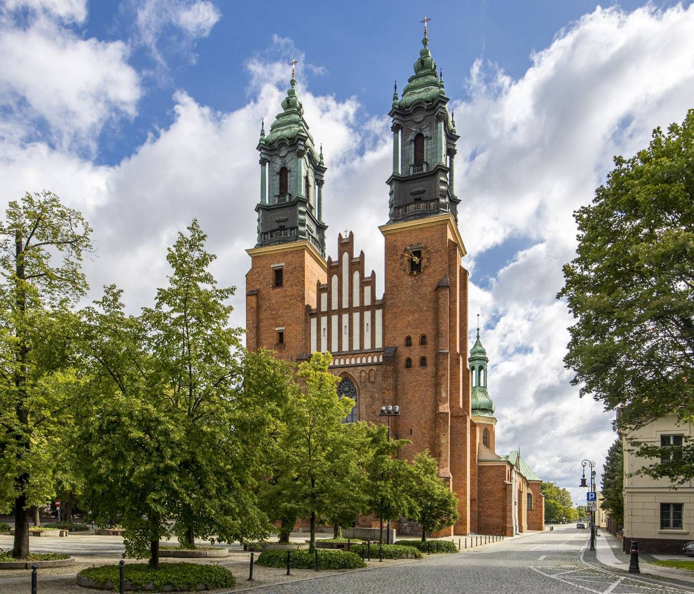 Twin towers of Poznań Cathedral on Ostrów Tumski under a blue sky