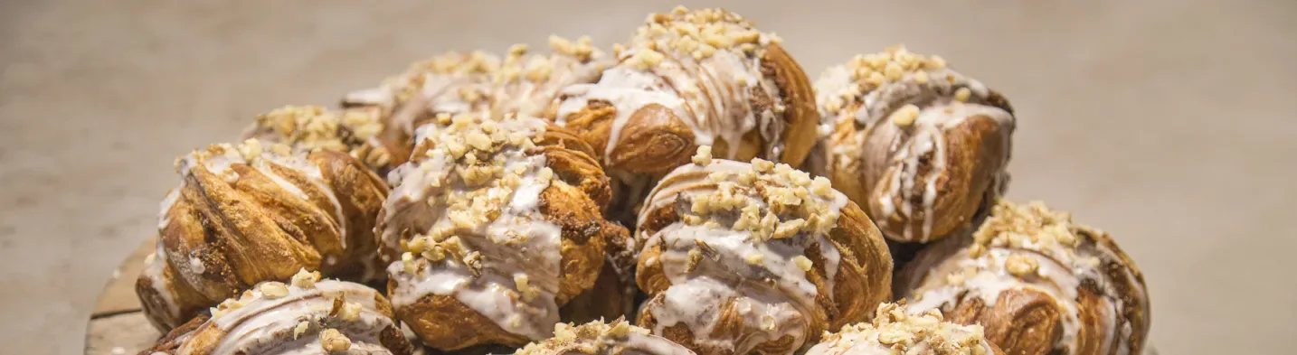 Traditional St. Martin’s croissants topped with icing and chopped nuts