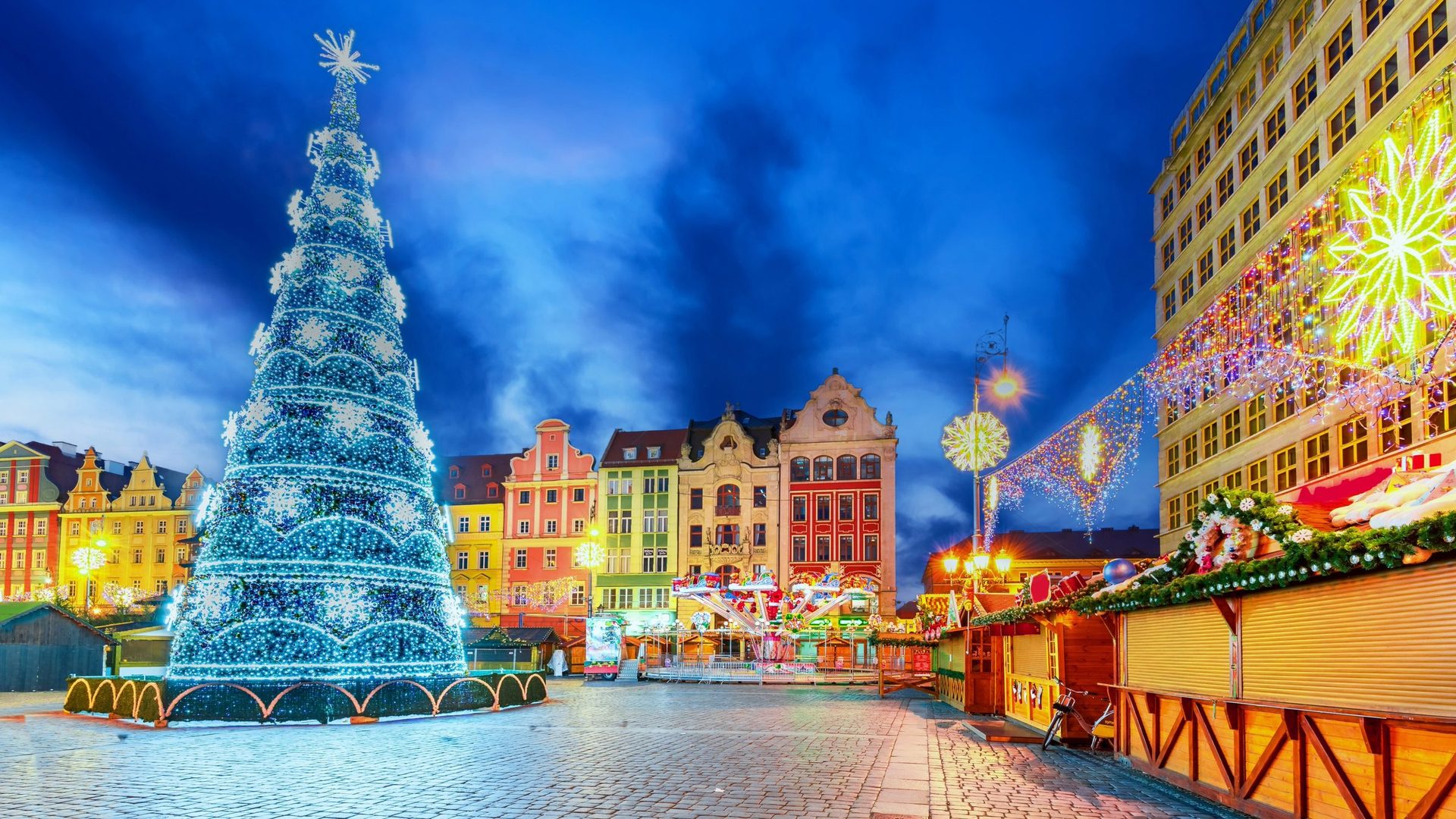 Wrocław's Christmas market glowing in the Market Square at dusk