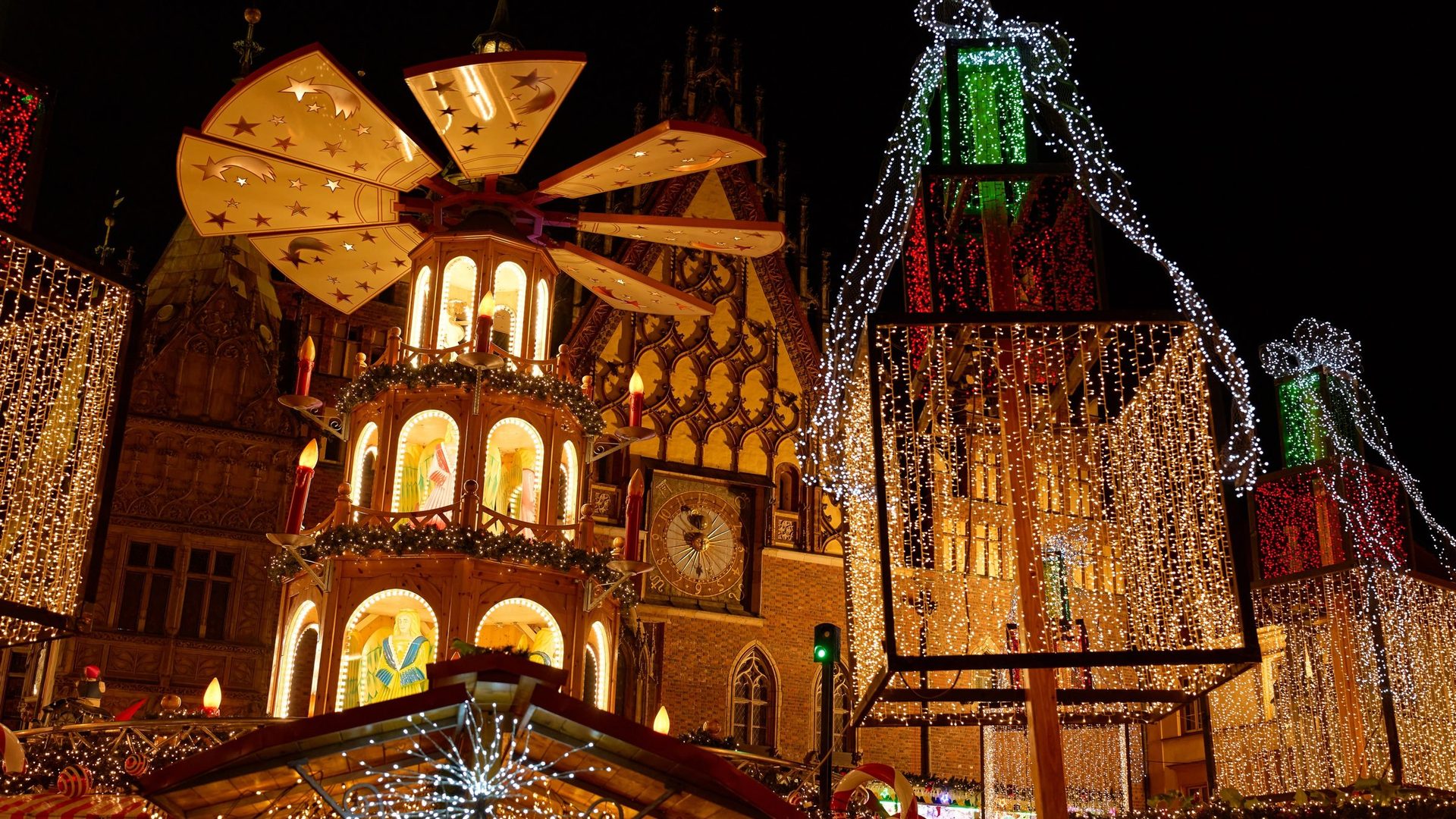 Wrocław Christmas market illuminated across the historic Market Square at night
