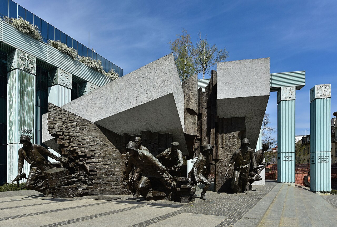 The Warsaw Uprising Monument in Warsaw, bronze insurgent figures breaking through a shattered wall